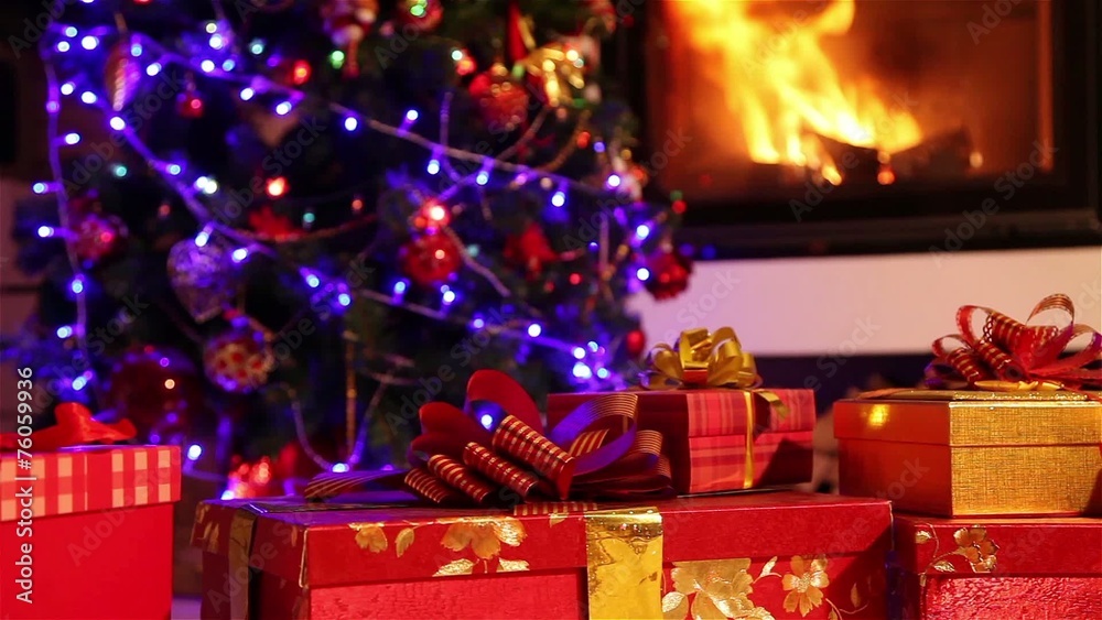Dolly shot of a Christmas gifts with fireplace in the background Dolly shot of a Christmas gifts with fireplace in the background