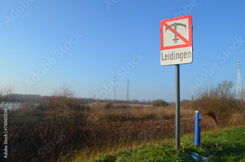 Sign on bank of river