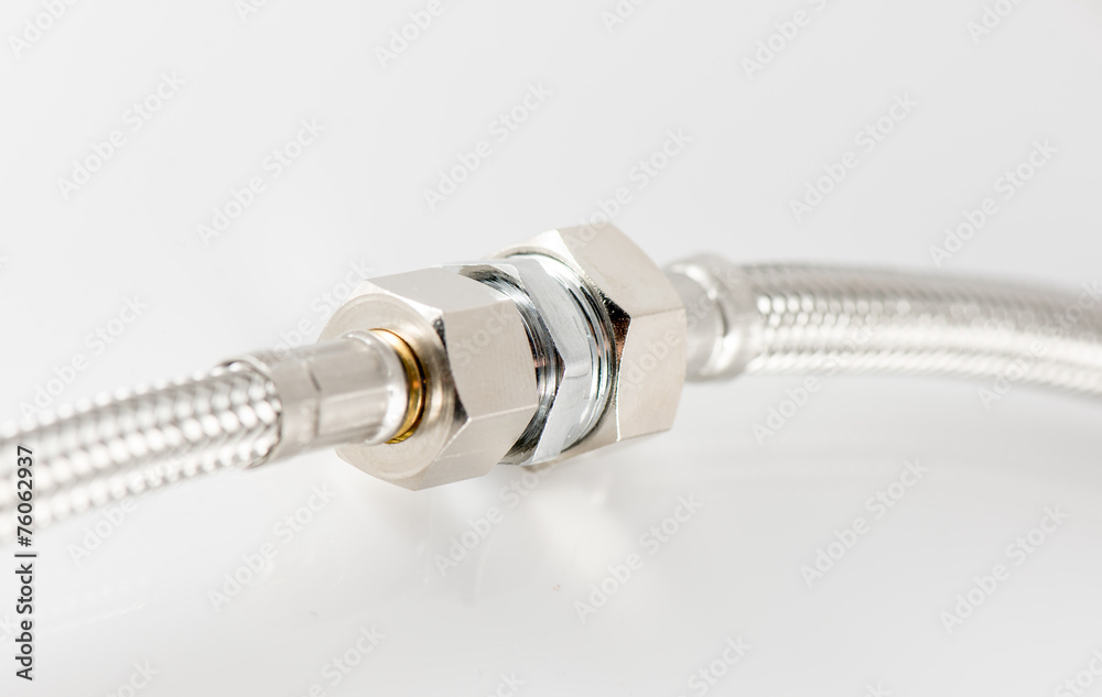 elastic metal fiber water pipe with connectors on white elastic metal fiber water pipe with connectors on white