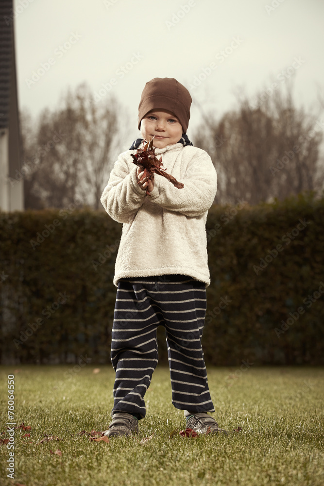 Young boy cleaning garden Young boy cleaning garden
