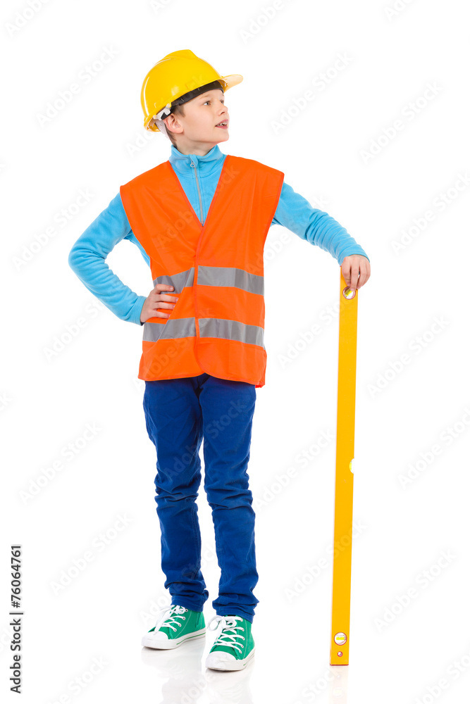 Little construction worker posing with a spirit level Little construction worker posing with a spirit level