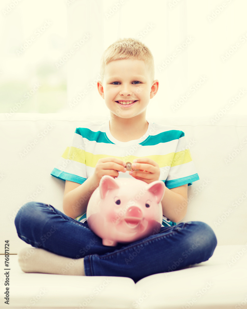 smiling little boy with piggy bank and money smiling little boy with piggy bank and money