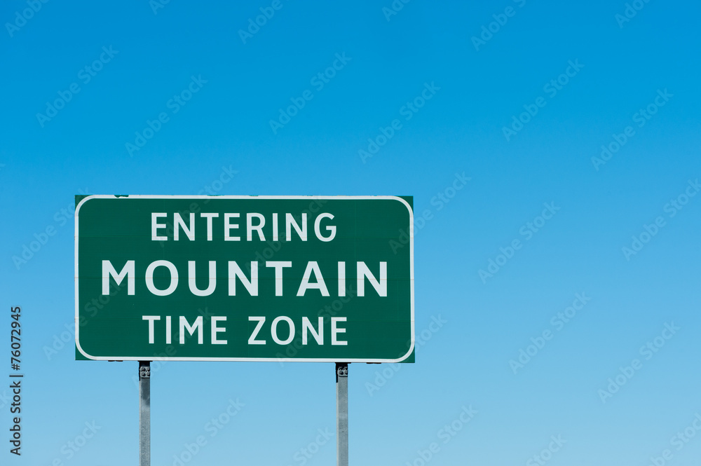 Road sign with Mountain time zone, New Mexico