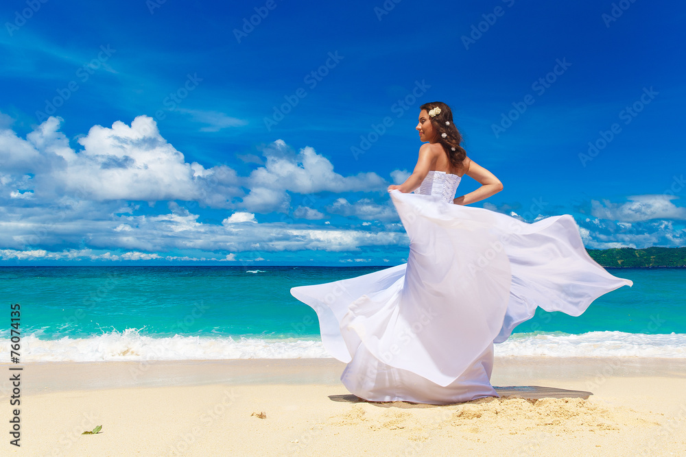 Beautiful brunette bride in white wedding dress with big long wh Beautiful brunette bride in white wedding dress with big long wh
