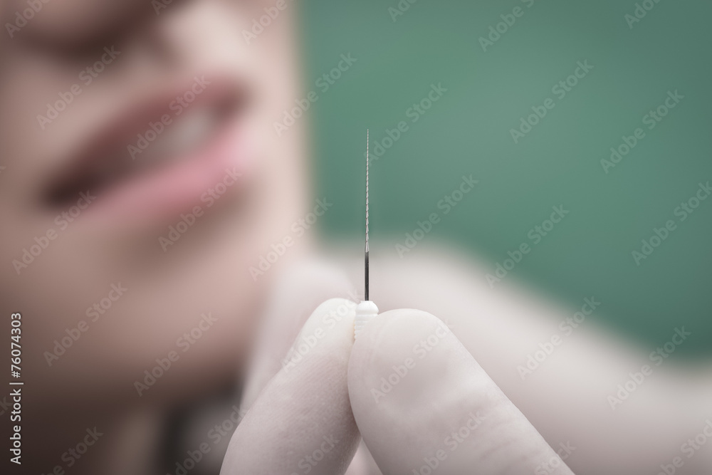 Young woman and dental instrument Young woman and dental instrument