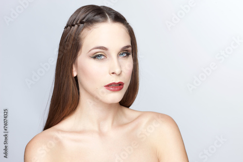 Portrait of beautiful young woman on white 
