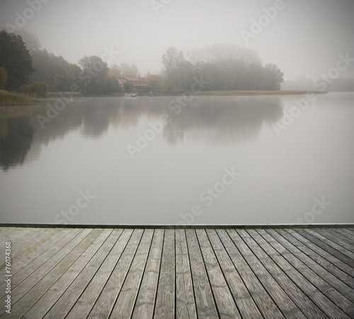 Fototapeta Naklejka Na Ścianę i Meble -  Footbridge with foggy lake