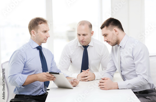 business team working with tablet pc in office