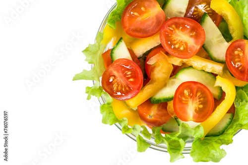Bowl with fresh vegetable salad. Isolated on white 