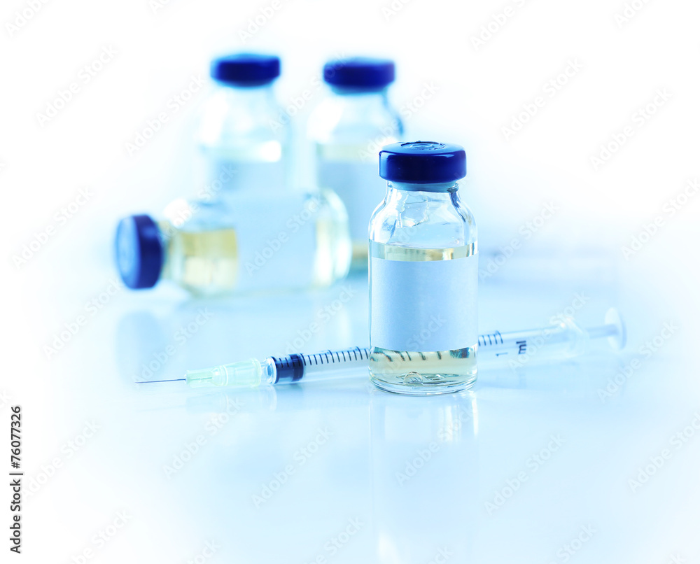Vaccine in vial with syringe Vaccine in vial with syringe