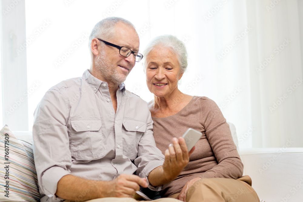 happy senior couple with smartphone at home happy senior couple with smartphone at home
