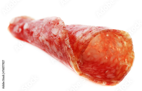 Slice of salami isolated on white background