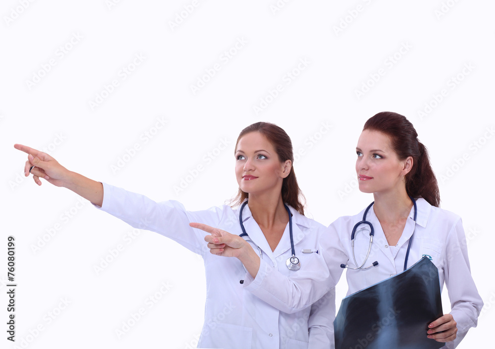 Two woman nurse watching X Ray image, standing in hospital Two woman nurse watching X Ray image, standing in hospital