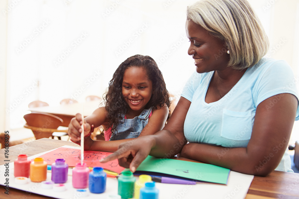 Grandmother Painting Picture With Granddaughter At Home Grandmother Painting Picture With Granddaughter At Home