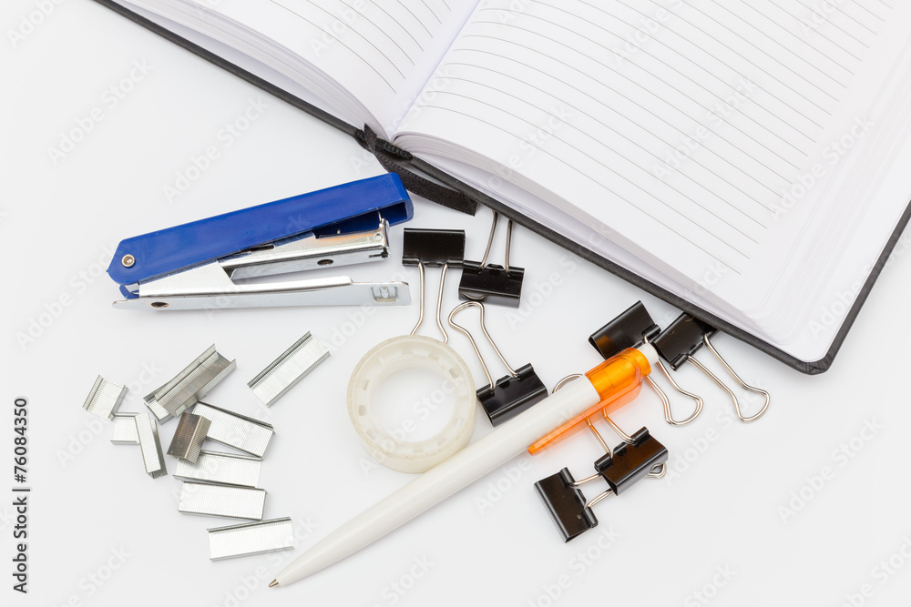 a lot of office supplies on a white background top view