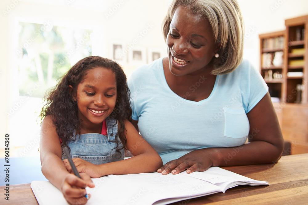 Grandmother Helping Granddaughter With Homework Grandmother Helping Granddaughter With Homework