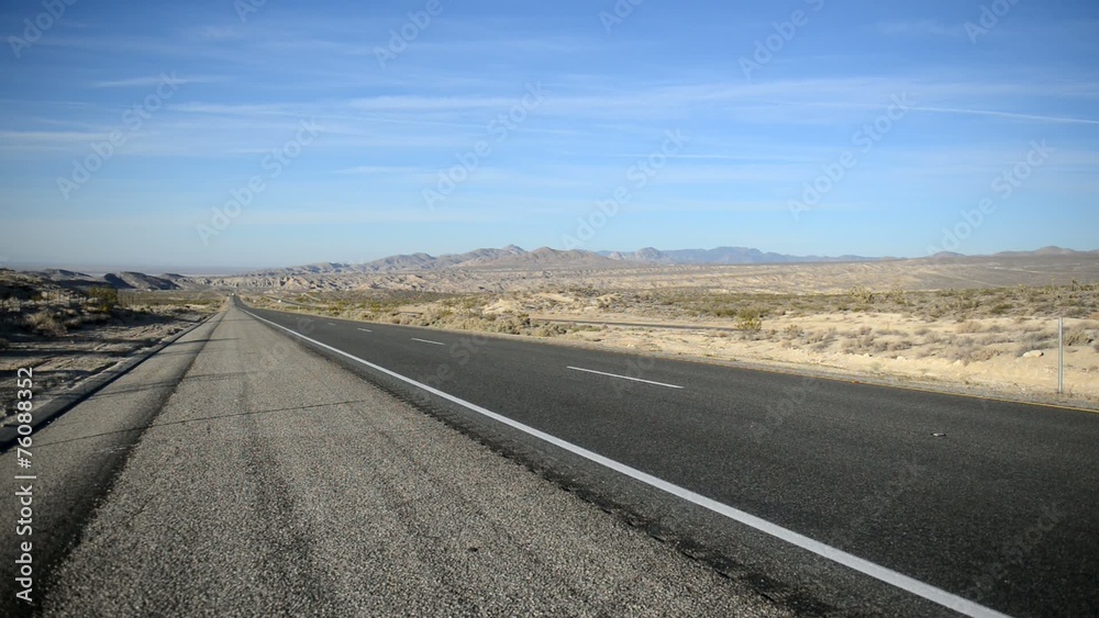 Remote stretch of road on Interstate in Desert and Mountains Remote stretch of road on Interstate in Desert and Mountains