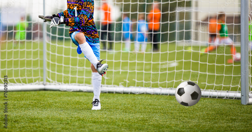Fototapeta premium Football match for children. soccer tournament. goalkeeper save