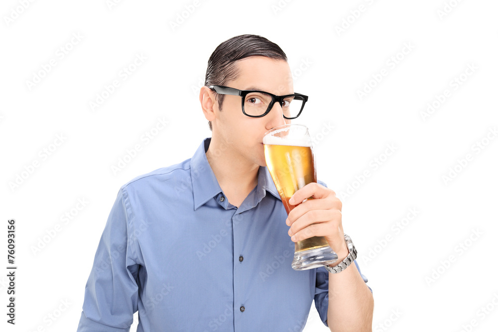 Young guy drinking a pint of beer