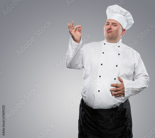 Funny overweight chef isolated on grey background