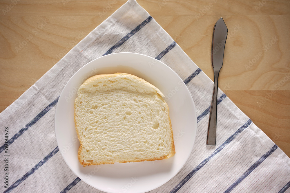 Single piece of white bread on table top