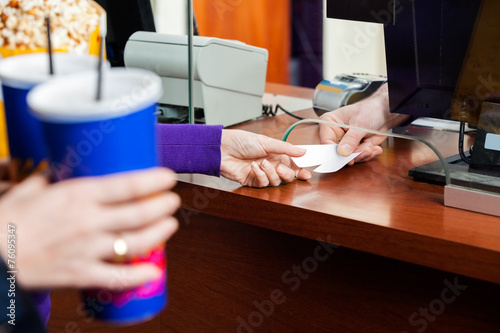 Women Buying Movie Tickets At Box Office