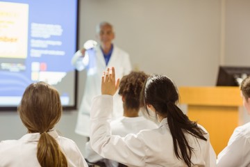 Science professor giving lecture to class