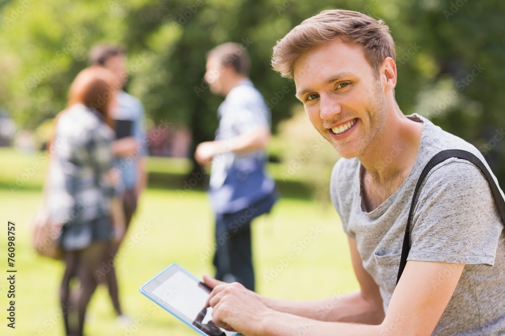 Handsome student studying outside on campus Handsome student studying outside on campus