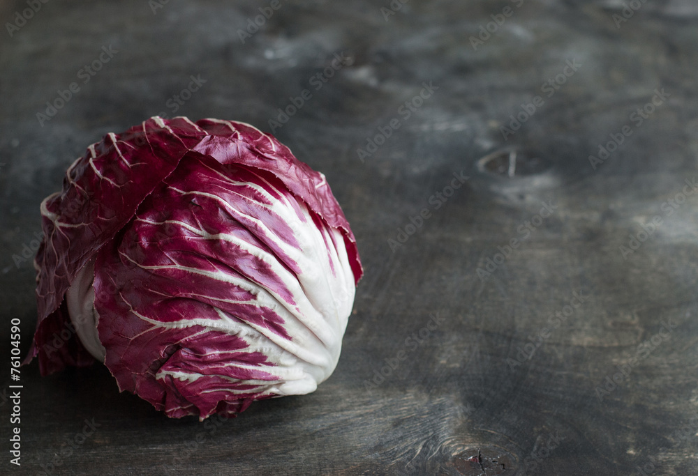 Obraz premium Radicchio red salad on wooden background. Horisontal
