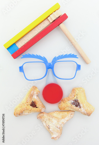 Purim arrangement - Hamantashen, Gragger,glasses and a red nose photo