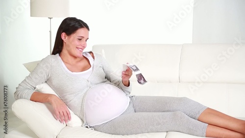 pregnant woman looking the sonogram of her child