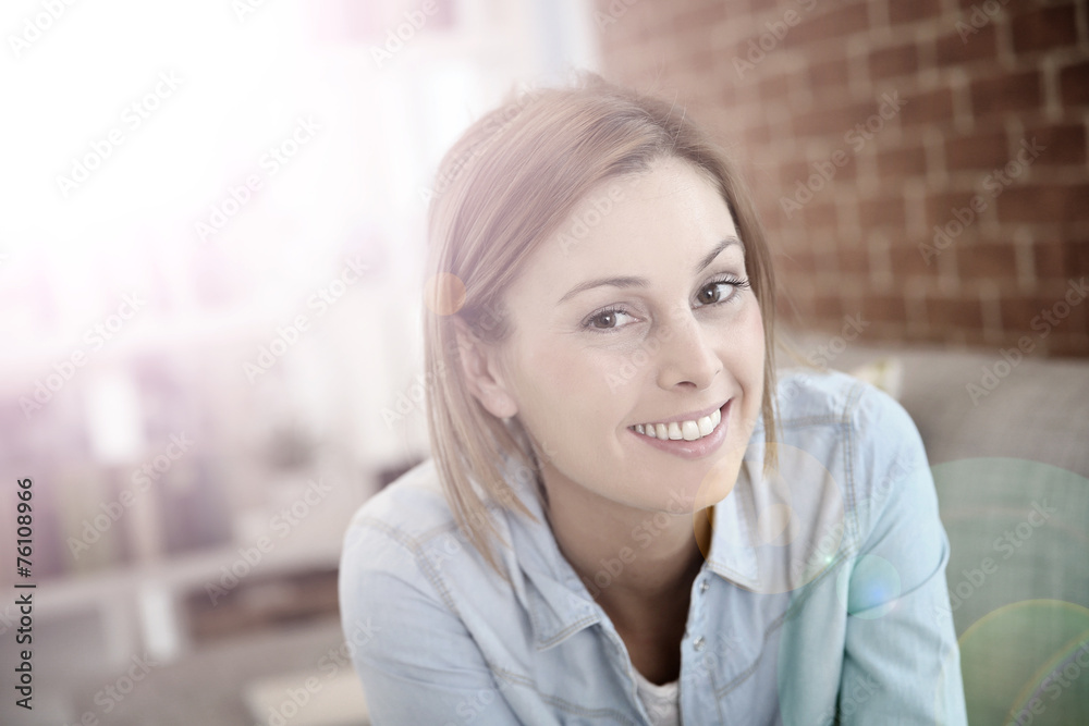 Portrait of charming young woman at home