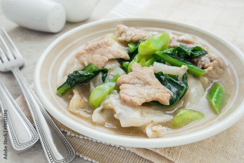 Fried noodle with pork and kale soaked in gravy Fried noodle with pork and kale soaked in gravy