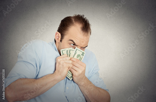 greedy banker executive CEO boss, holding dollar banknotes photo