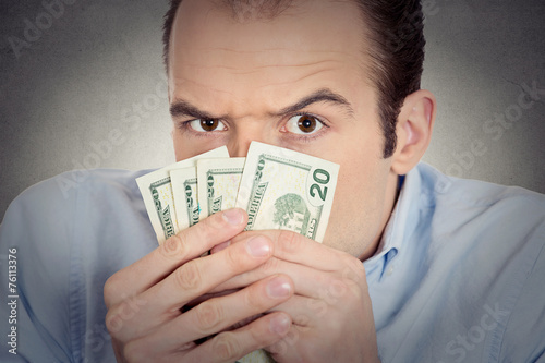 greedy banker executive CEO boss, holding dollar banknotes