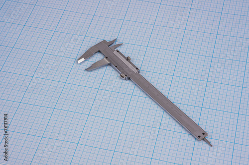 Vernier-caliper on graph paper photo