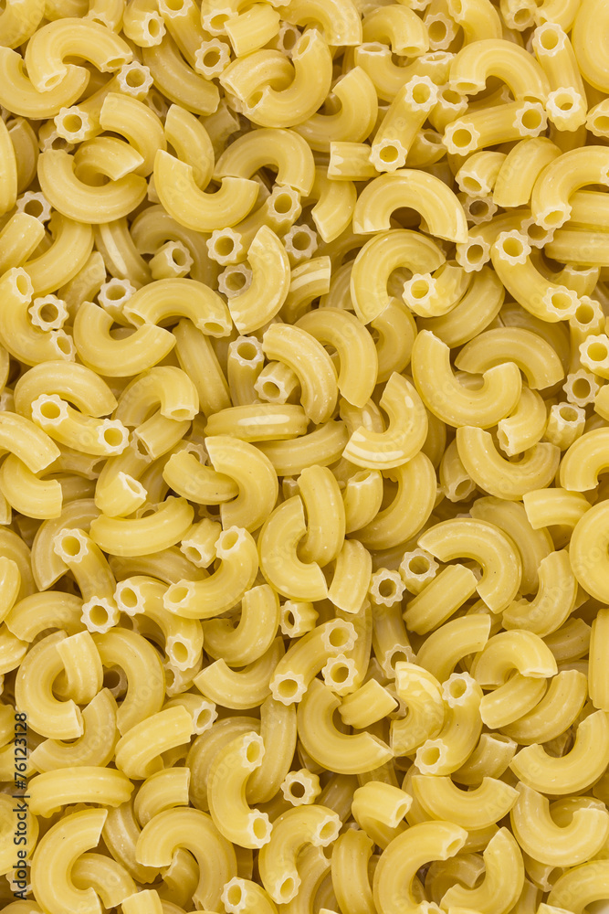 background of raw pasta from durum wheat background of raw pasta from durum wheat