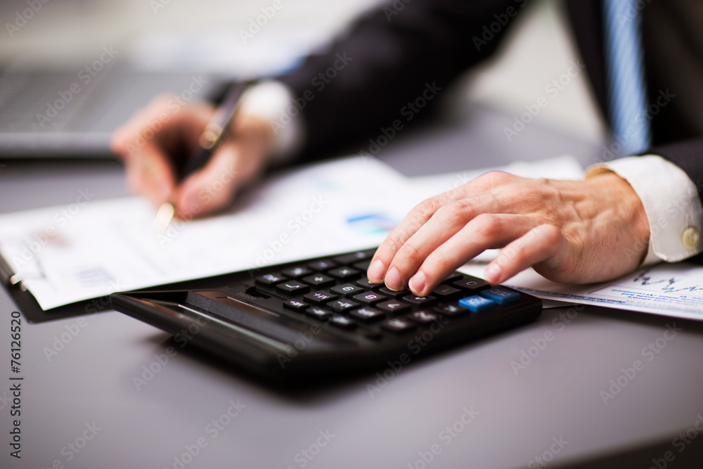 Man doing his accounting, financial adviser working Man doing his accounting, financial adviser working