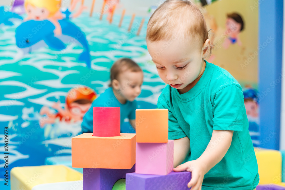 little boy playing with cubes little boy playing with cubes