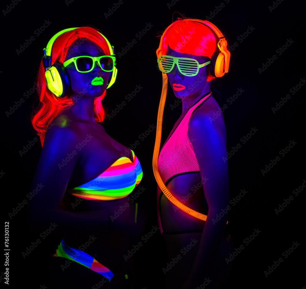 two sexy neon uv glow dancers ภาพถ่ายสต็อก | Adobe Stock