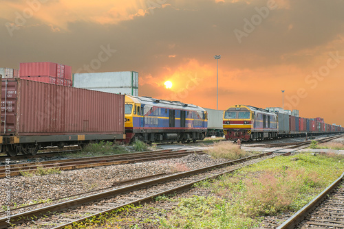 Freight trains on cargo terminal at dusk