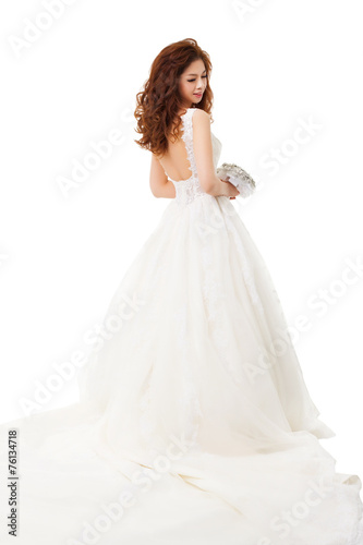 Young  beautiful bride holding flowers