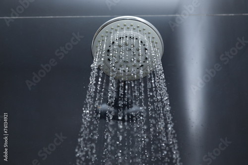 shower head in bathroom with water drops flowing © sutichak