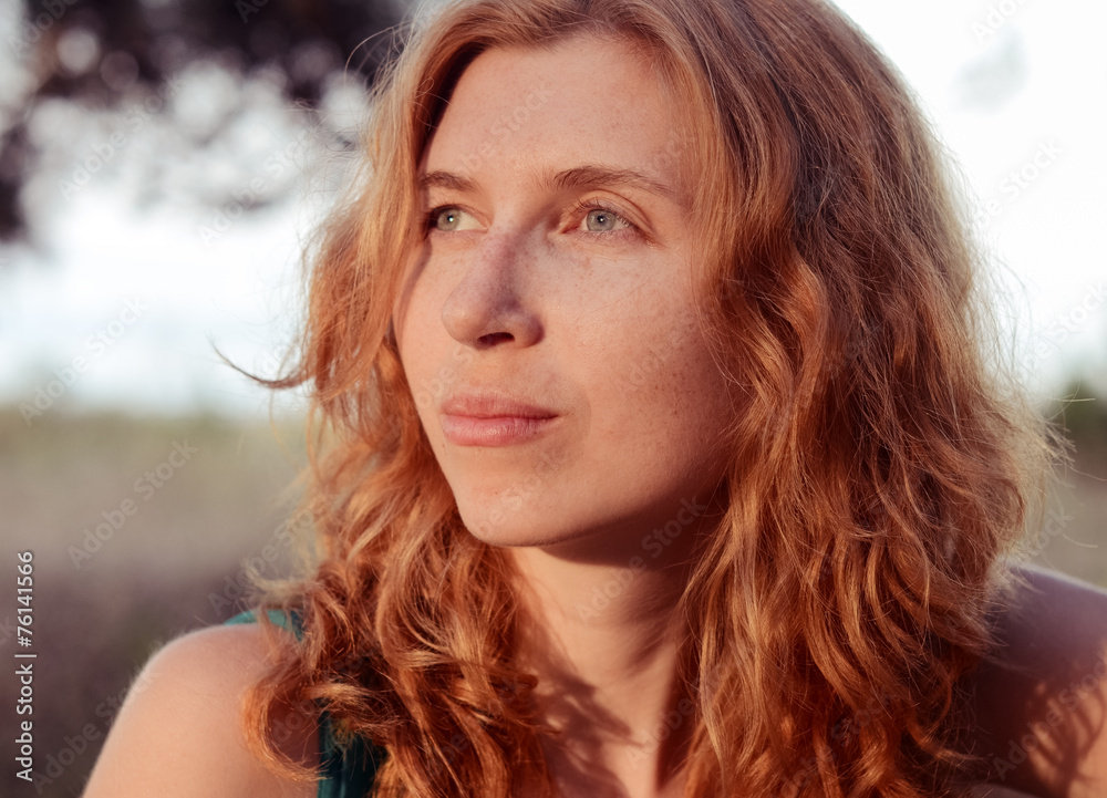 Portrait of a dreaming and beautiful red-haired girl. Portrait of a dreaming and beautiful red-haired girl.