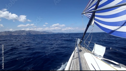 Luxury yachts. Sailing in the wind through the waves.