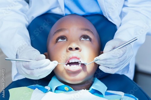 Close up of boy having his teeth examined