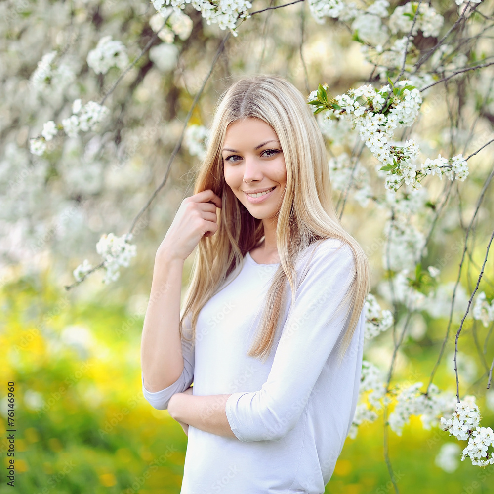 Portrait of beautiful woman in blooming tree in spring Portrait of beautiful woman in blooming tree in spring