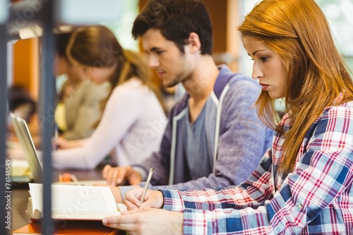 Four focused classmates working together