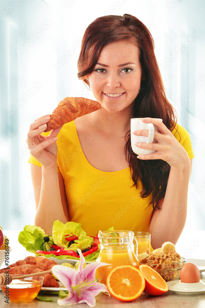 Young woman having breakfast. Balanced diet Young woman having breakfast. Balanced diet