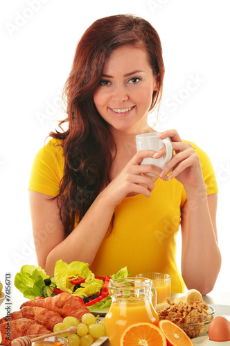 Young woman having breakfast. Balanced diet